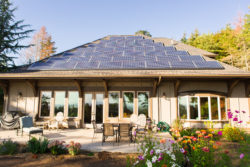 Custom home with solar panels porch view