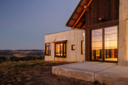 Board formed concrete chimney and bedroom detail and shou sugi ban siding